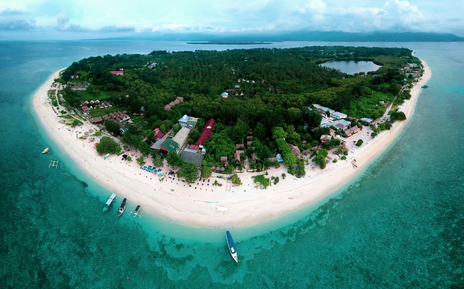 Aerial view of a Gili island with white sand